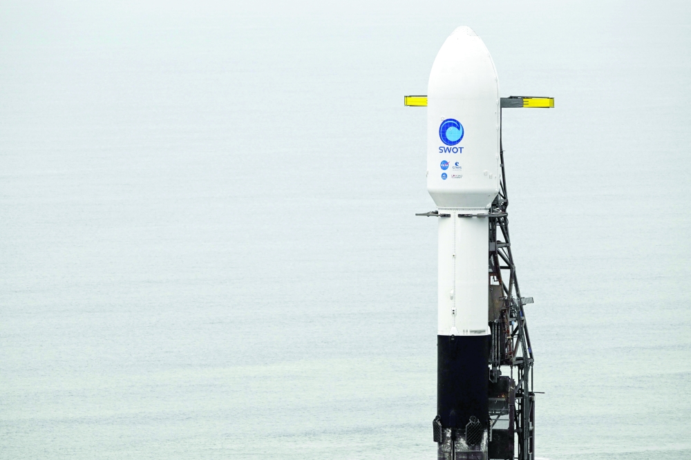 A SpaceX Falcon 9 rocket stands on a launch pad with the Surface Water and Ocean Topography satellite from Nasa and France's space agency CNES at the Vandenberg Space Force Base in Lompoc, California. -- AFP