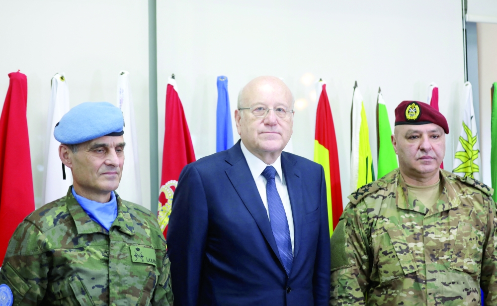 Lebanon's caretaker prime minister Najib Mikati and Lebanon's Army chief General Joseph Aoun with UNIFIL Head of Mission and Force Commander Major General Aroldo Lazaro, during their visit to UNIFIL headquarters in Naqura. - Reuters
