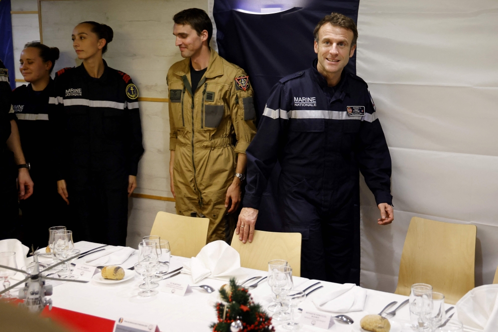 French President Emmanuel Macron takes in a special dinner with navy soldiers before attending a regional conference in Jordan 