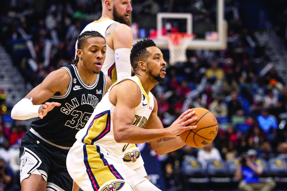 New Orleans Pelicans' CJ McCollum (3) shoots a jump shot against San Antonio Spurs' Romeo Langford (35) during the second half at Smoothie King Center in New Orleans, Louisiana. -- USA Today Sports
