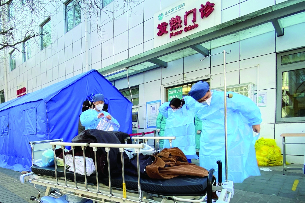 Nurses don protective aprons outside a fever clinic at a hospital as coronavirus disease outbreaks continue in Beijing. - Reuters 