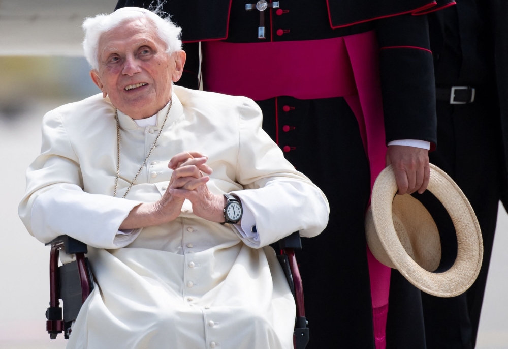 In this file photo taken on June 22, 2020 Former pope Benedict XVI poses for a picture at the airport in Munich, southern Germany