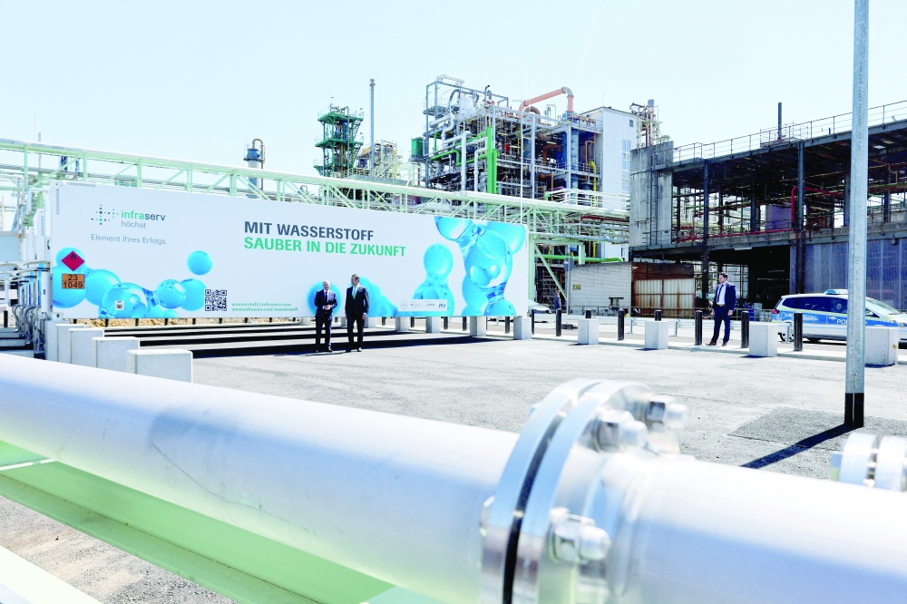German Chancellor Olaf Scholz visits a hydrogen station for trains at the former headquarters of German chemical firm Hoechst AG, in Hoechst. -- Reuters 