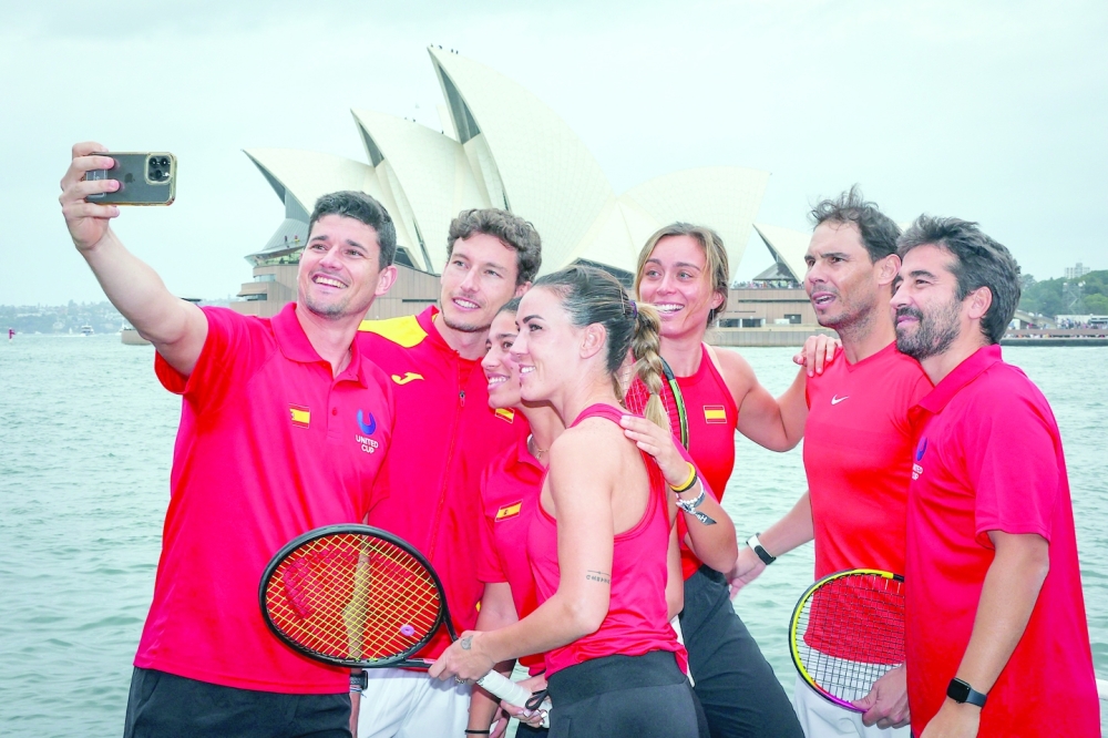 Team Spain players (L-R) David Vega Hernandez, Pablo Carreno Busta, Jessica Bouzas Maneiro, Nuria Parrizas Diaz, Paula Badosa, Rafael Nadal and team coach Marc Lopez pose for a selfie in front of the Sydney Opera House during a promotional event for the United Cup tournament in Sydney. — AFP