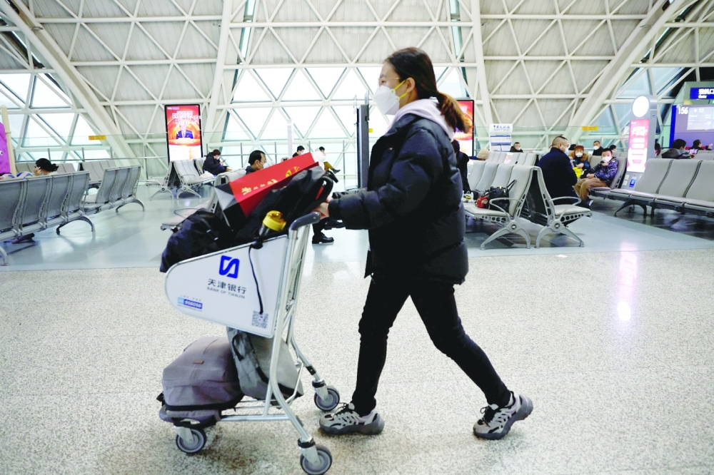 A traveller pushes a luggage cart at Chengdu Shuangliu International Airport amid a wave of Covid-19 infections in Chengdu, Sichuan province. - Reuters

