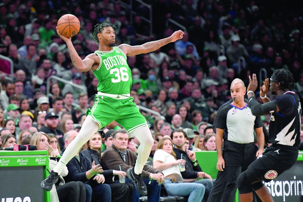 Dec 29, 2022; Boston, Massachusetts, USA;  Boston Celtics guard Marcus Smart (36) tries to save the ball from going out of bounds during the second half against the LA Clippers at TD Garden. Mandatory Credit: Bob DeChiara-USA TODAY Sports