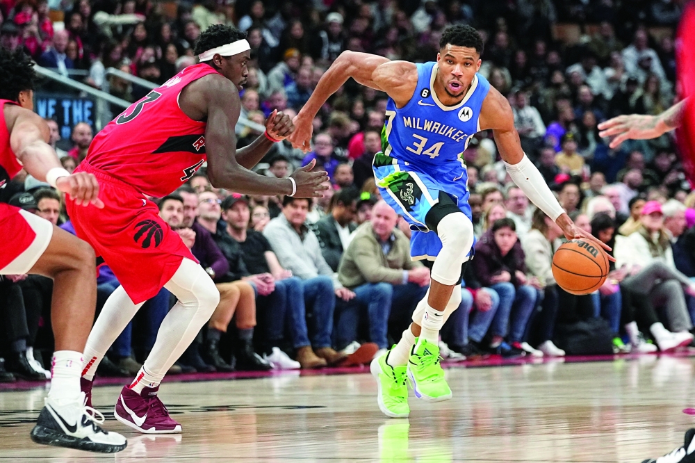 Jan 4, 2023; Toronto, Ontario, CAN; Milwaukee Bucks forward Giannis Antetokounmpo (34) drives to the net against Toronto Raptors forward Pascal Siakam (43) during the second half at Scotiabank Arena. Mandatory Credit: John E. Sokolowski-USA TODAY Sports

