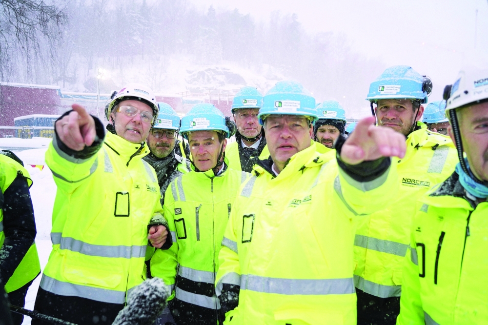 German Economy Minister and Vice-Chancellor Robert Habeck (C-R) visits the cement producer Norcem in Brevik, Norway. Habeck visited the site to get informed about the ongoing work with CO2 capture at the facility. - AFP