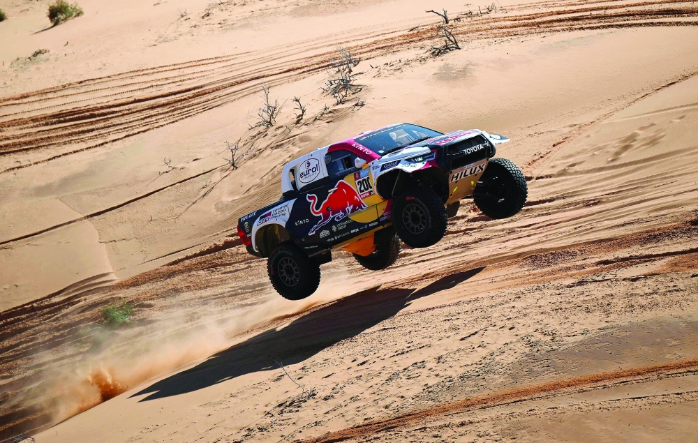 TOPSHOT - Toyota's Qatari driver Nasser Al-Attiyah and his French co-driver Mathieu Baumel compete during the Stage 5 of the Dakar 2023 around Ha'il, Saudi Arabia, on January 5, 2023.  (Photo by FRANCK FIFE / AFP)


