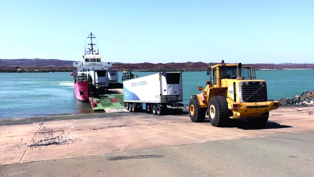 Supplies are unloaded from a barge as part of relief efforts to flood-affected communities in the Kimberley on Monday.  — Reuters