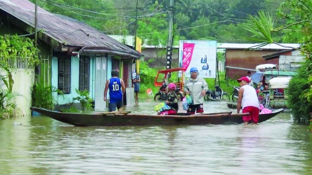 Since January 3, back-to-back storms have killed 11 people as floodwaters swept through houses. -- AFP