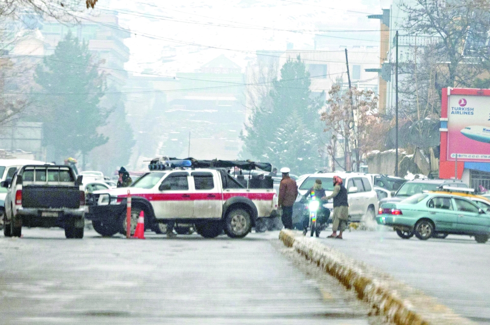 Taliban security forces block a road after a suicide blast near Afghanistan's Foreign Ministry at the Zanbaq Square in Kabul. -- AFP