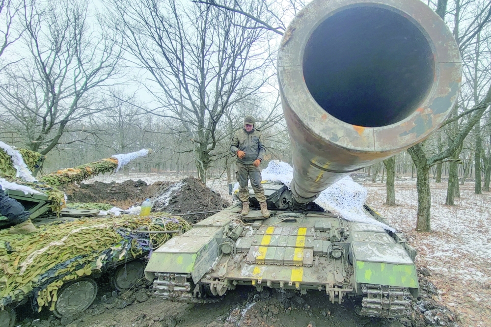 A Ukrainian serviceman stands on a tank near the frontline town of Bakhmut amid Russia's attack on Ukraine in Donetsk region. - Reuters
