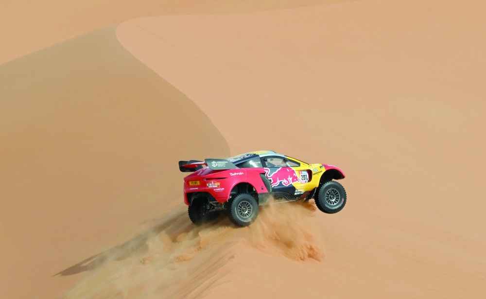 French driver Sebastien Loeb and Belgian co-driver Fabian Lurquin steers his Brx during during Stage 12 of the Dakar 2023 between Empty Quarter Marathon and Saybah, in Saudi Arabia, on January 13, 2023.  (Photo by FRANCK FIFE / AFP)

