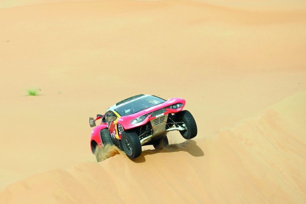 French driver Sebastien Loeb and Belgian co-driver Fabian Lurquin steers his Brx during during Stage 12 of the Dakar 2023 between Empty Quarter Marathon and Saybah, in Saudi Arabia, on January 13, 2023.  (Photo by FRANCK FIFE / AFP)

