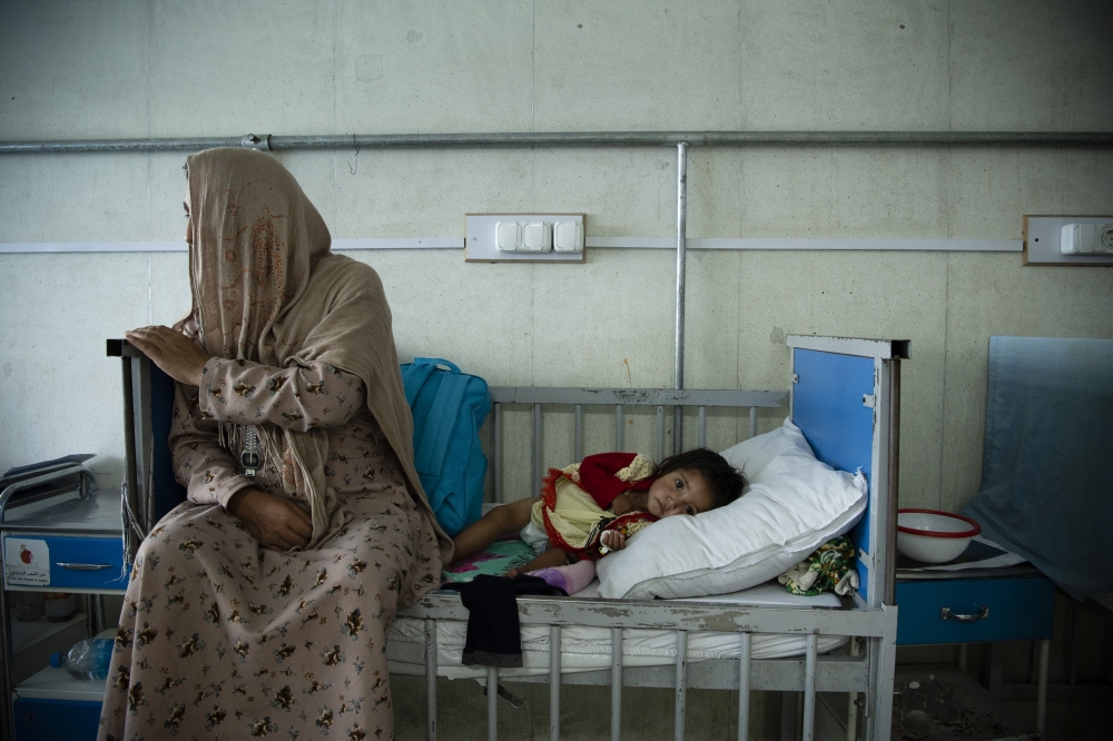 Fatima, 15 months, and her mother at at Indira Gandhi Hospital’s overwhelmed malnutrition ward in Kabul.