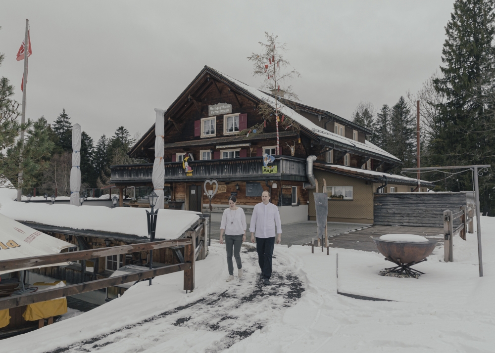Julia and Silvan Betschart at Herrenboden, their rustic lodge in Sattel, Switzerland, that they turned into a year-round destination, catering to hikers in warmer months, Jan. 11, 2023. (Andrea Mantovani/The New York Times)