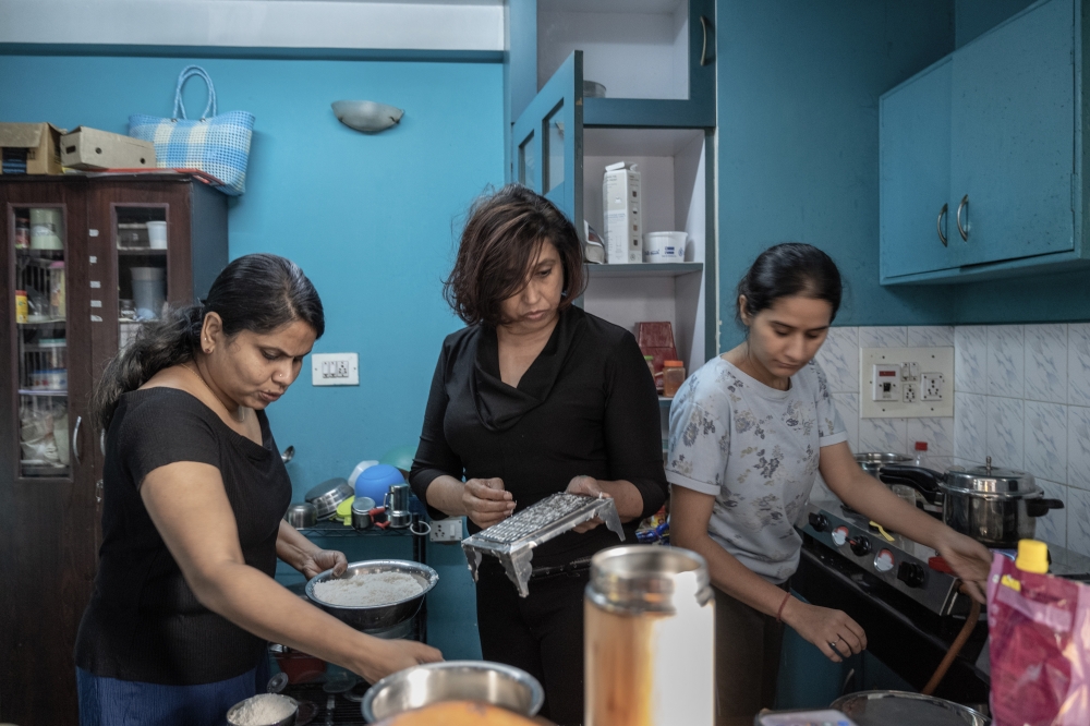 From left: Navya V.P, Meera Shankar and Vandana Naugain,  in their shared apartment in Bengaluru, India, Jan. 14, 2023. (Saumya Khandelwal/The New York Times)