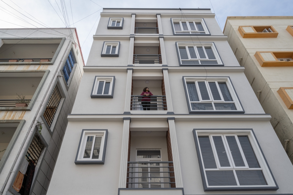 Ruchita Chandrashekar on the balcony of the apartment she found after a difficult search, in Bengaluru, India, Jan. 13, 2023. (Saumya Khandelwal/The New York Times)