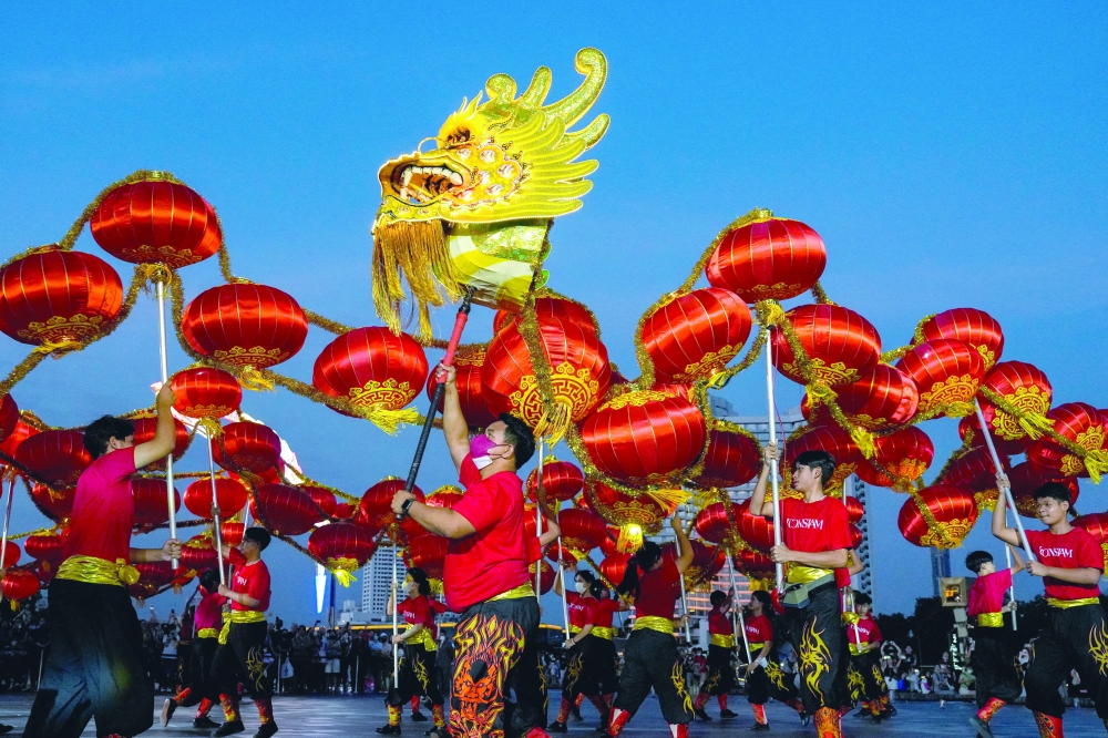 A dragon dance performance is seen ahead of the Lunar New Year celebration in Bangkok on Wednesday. — Reuters