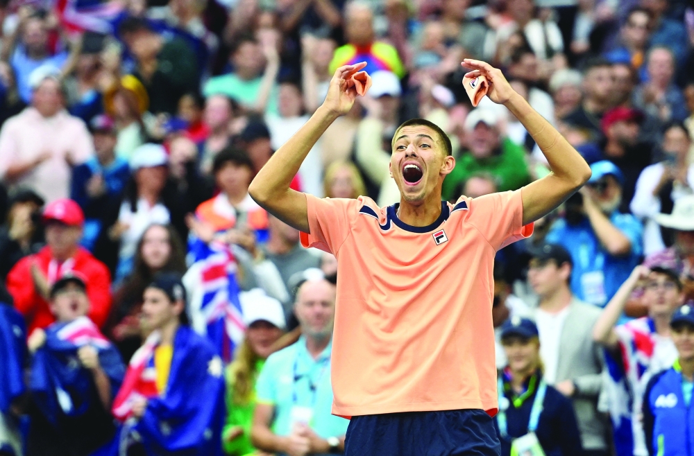 Tennis - Australian Open - Melbourne Park, Melbourne, Australia - January 19, 2023 Australia's Alexei Popyrin celebrates winning his second round match against Taylor Fritz of the U.S. REUTERS/Jaimi Joy     TPX IMAGES OF THE DAY

