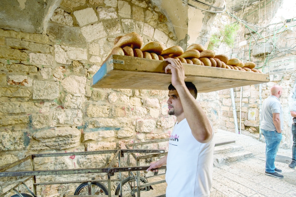 A tray of kaak-al-quds (oval ring-shaped sesame-studded breads) from Al Razim bakery in the Old City of Jerusalem, Oct. 12, 2022. (Tzachi Ostrovsky/The New York Times)