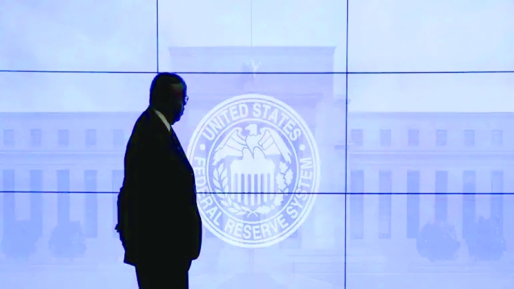 A security man walks past US Federal Reserve logo in Washington. — AFP