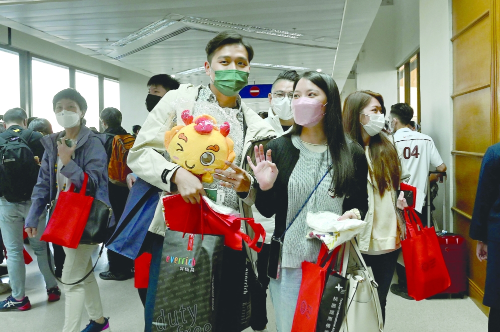 Visitors from China arrive at Ninoy Aquino International Airport in Paranaque, Metro Manila on Tuesday. — AFP