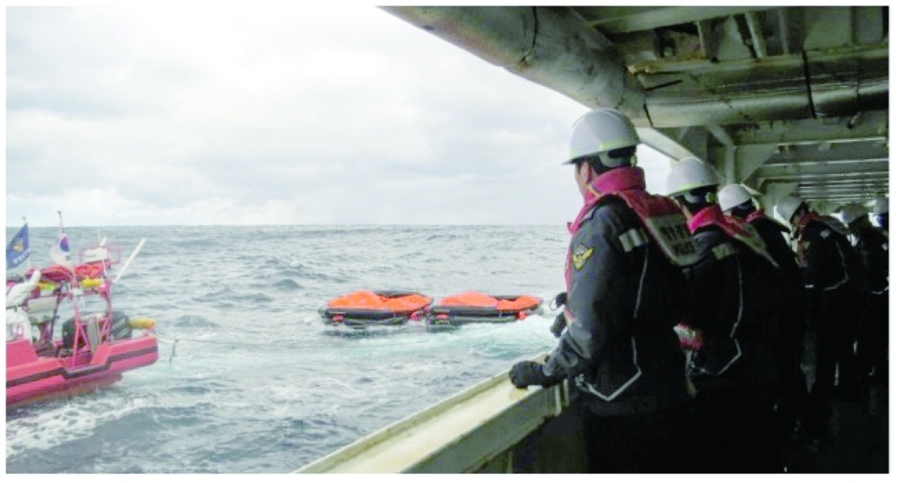 Coast guard members searching for missing people after a Hong Kong cargo ship sank off South Korea’s southern island of Jeju.- AFP
