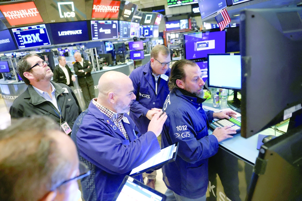 Traders work on the trading floor at the New York Stock Exchange (NYSE) in New York City. - Reuters
