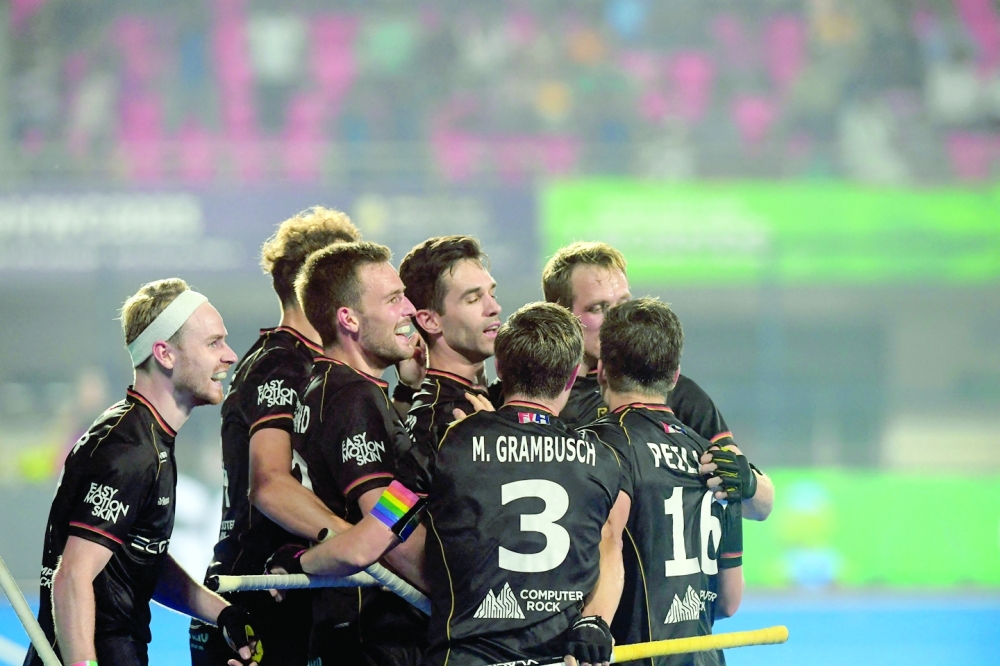 German players celebrate after scoring the winning goal during the men's semi-final match between Australia and Germany at the FIH Odisha Field Hockey Men's World Cup 2023, in Bhubaneswar on January 27, 2023.  (Photo by Dibyangshu SARKAR / AFP)

