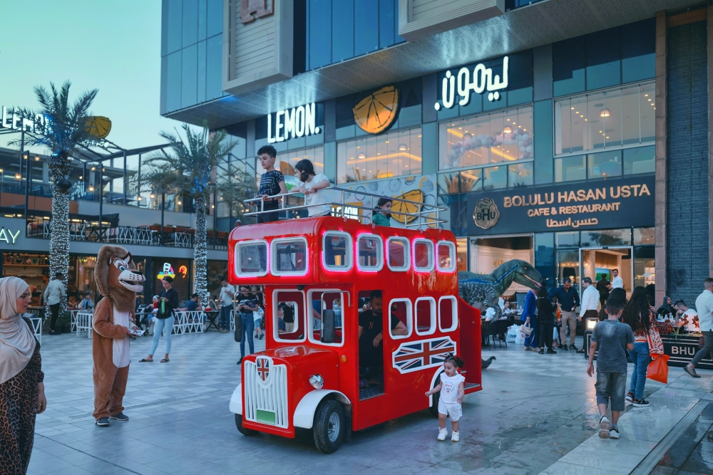 Shoppers at the Babylon Mall, which was built on a date palm grove in central Baghdad.
