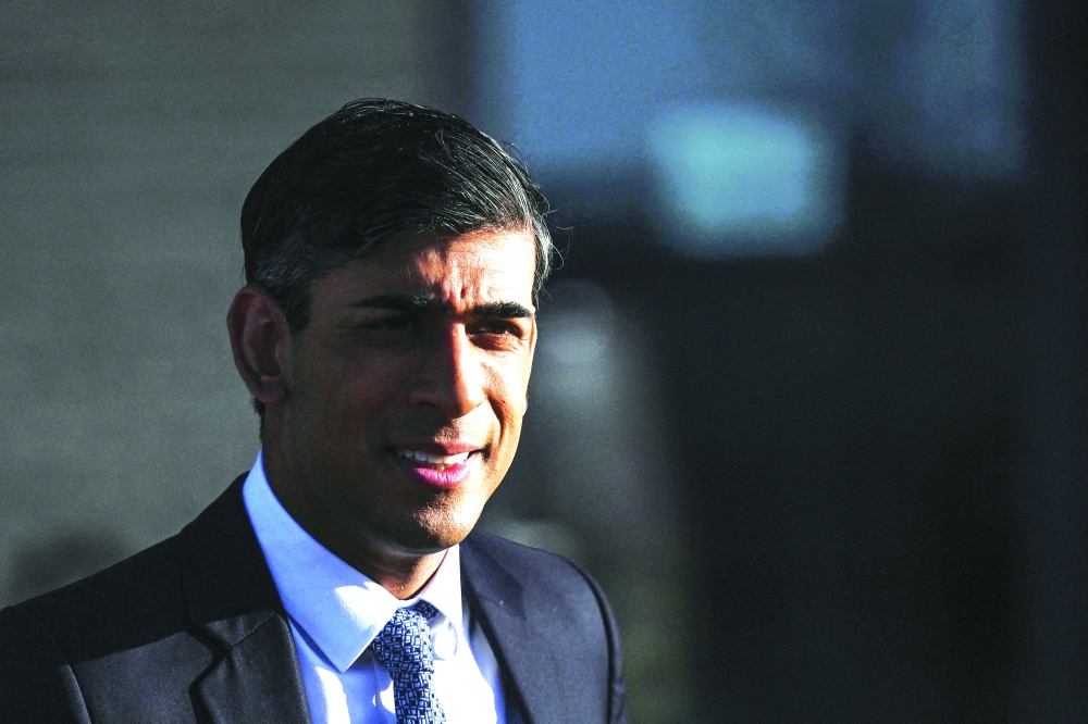 Britain's Prime Minister Rishi Sunak reacts as he leavesTeesside University in Darlington, Britain, on Monday. -- Reuters