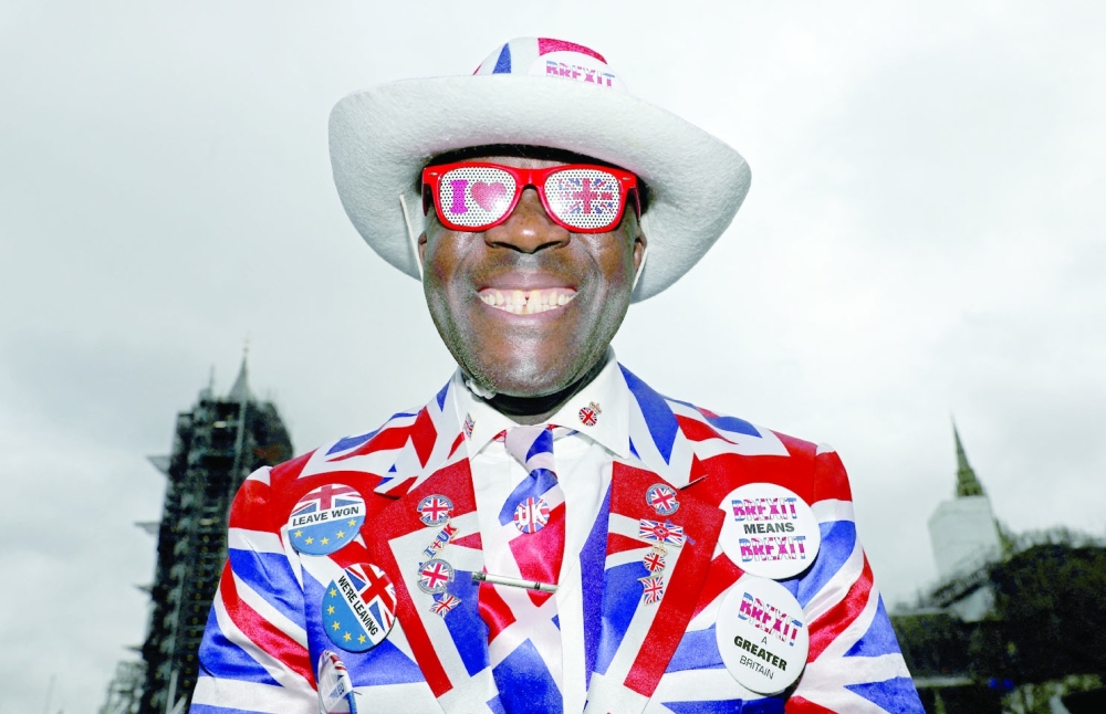 A pro-Brexit supporter smiles as he poses on Parliament Square, on Brexit day, in London, Britain, on January 31, 2020. - Reuters file photo