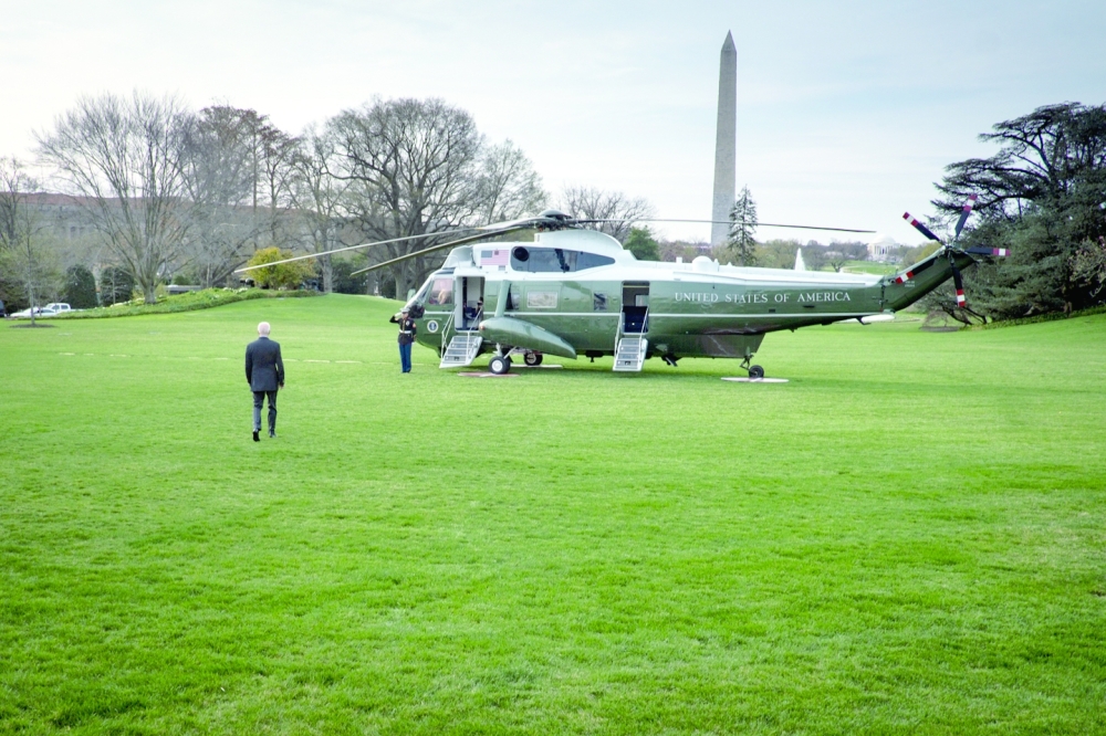 President Joe Biden walks towards Marine One on the South Lawn of the White House in Washington.  What will matter in 2073 is whether he reversed the global tide of democratic retreat that began long before his presidency but reached new heights with the Taliban’s victory in Afghanistan and Russia’s invasion of Ukraine, writes The New York Times columnist. 