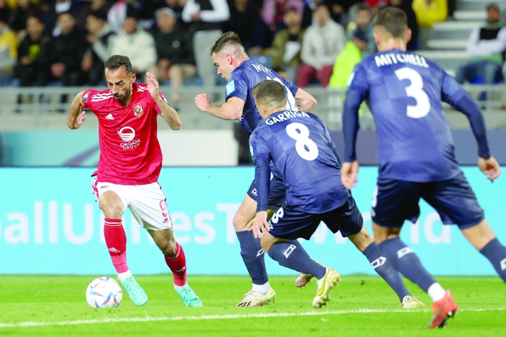 Ahly's Egyptian forward Ahmed Abdel Kader (L) is marked by Auckland City's forward Regont Murati during the FIFA Club World Cup first round football match between Egypt's Al-Ahly and New Zealand's Auckland City at the Ibn Batouta Stadium in Tangier on February 1, 2023. (Photo by Fadel Senna / AFP)

