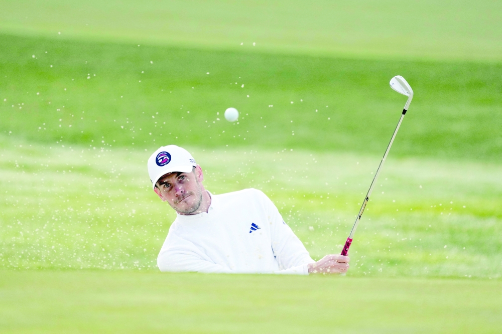 FILE PHOTO: February 2, 2023; Pebble Beach, California, USA; Gareth Bale hits his bunker shot on the first hole during the first round of the AT&T Pebble Beach Pro-Am golf tournament at Spyglass Hill Golf Course. Mandatory Credit: Ray Acevedo-USA TODAY Sports/File Photo
