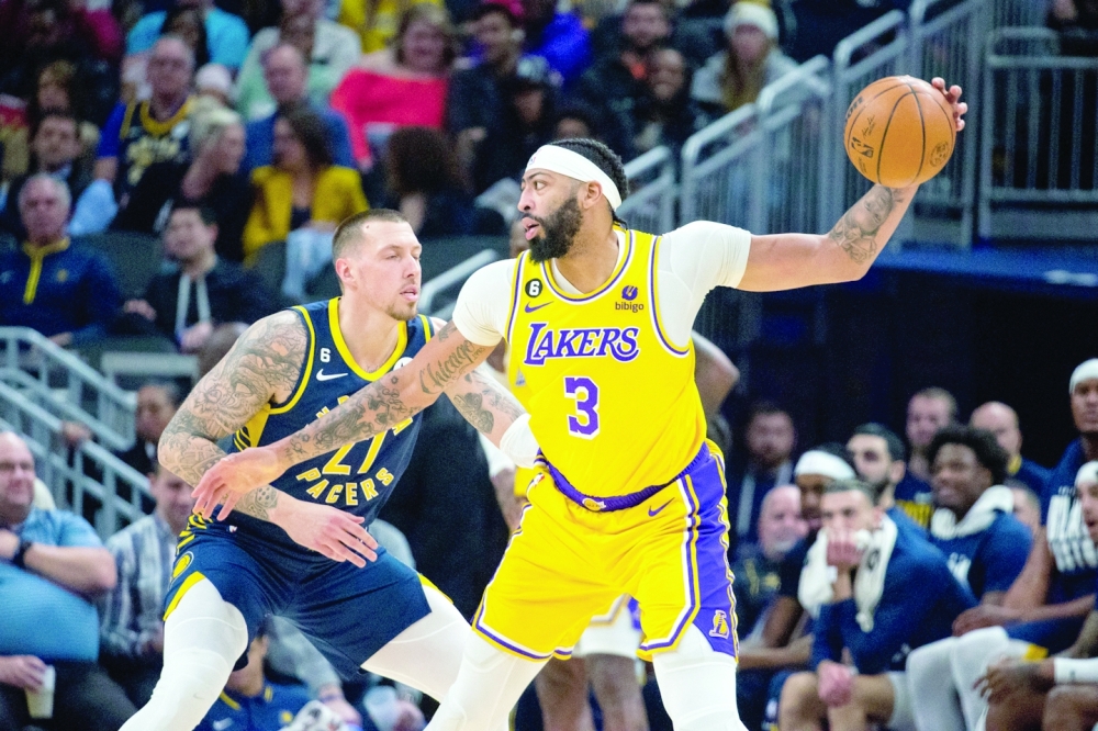 Feb 2, 2023; Indianapolis, Indiana, USA; Los Angeles Lakers forward Anthony Davis (3) catches the ball while Indiana Pacers center Daniel Theis (27) defends in the second quarter at Gainbridge Fieldhouse. Mandatory Credit: Trevor Ruszkowski-USA TODAY Sports
