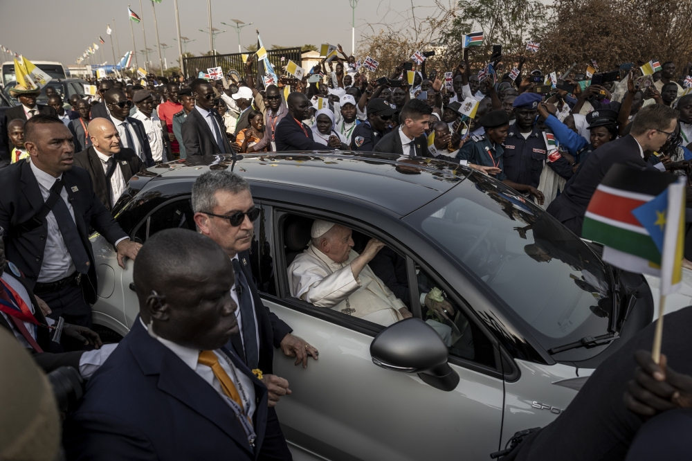 Pope Francis leaves the airport in a motorcade after arriving in Juba, South Sudan on Friday, Feb. 3, 2023. (Jim Huylebroek/The New York Times)