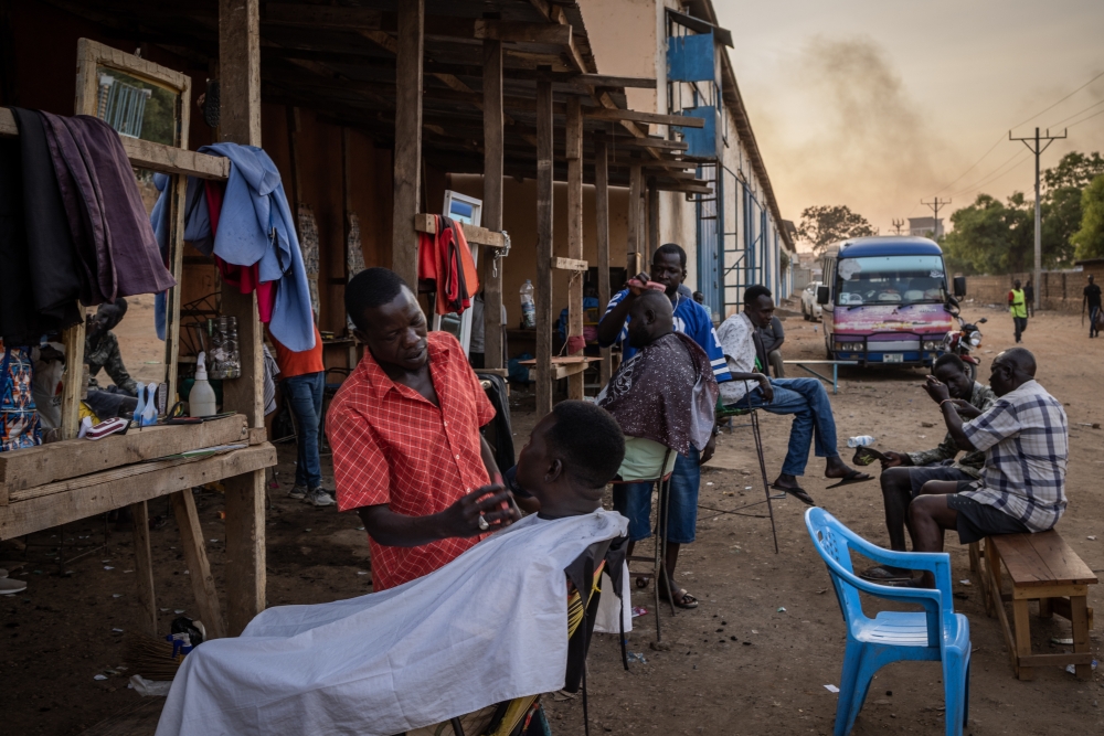 An outdoor barbershop in Juba, South Sudan on Jan. 29, 2023.  (Jim Huylebroek/The New York Times)