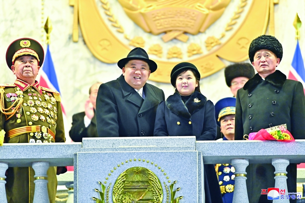 North Korean leader Kim Jong Un and daughter Kim Ju Ae attend a military parade to mark the 75th founding anniversary of North Korea's army, at Kim Il Sung Square in Pyongyang. -- Reuters 