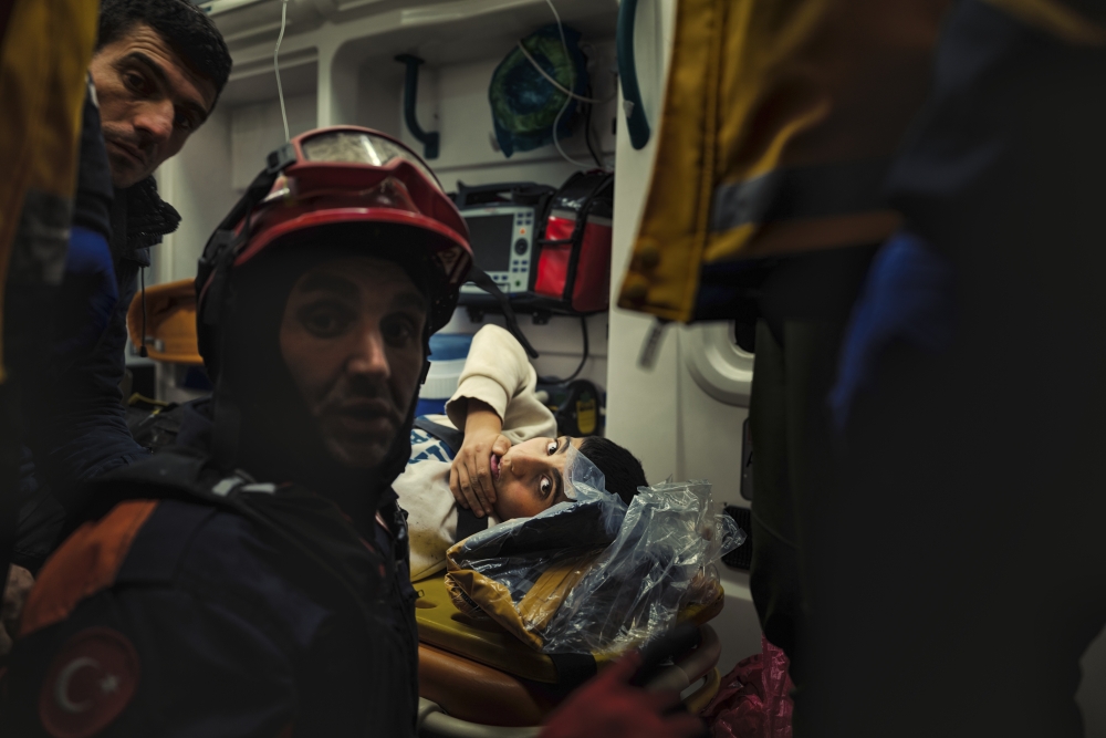A young boy is treated in an ambulance after being pulled from the rubble three days after the earthquake in Antakya, Turkey, on Feb. 8, 2023. (Emily Garthwaite/The New York Times)