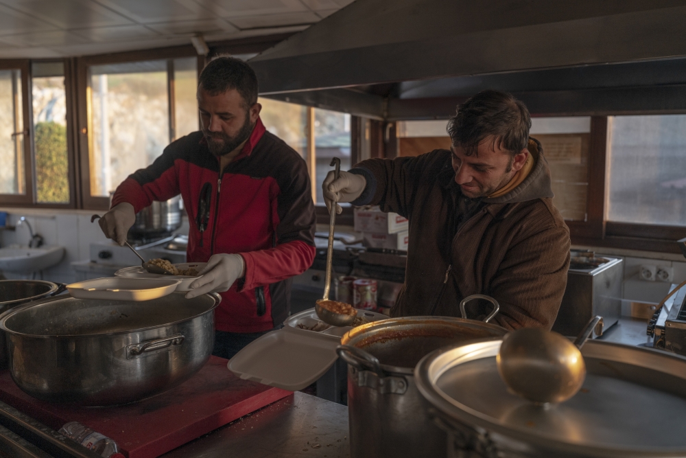 Volunteers serve food to displaced residents in a shelter and former restaurant in Antakya, in Hatay Province, Turkey, on Feb. 9, 2023. (Emily Garthwaite/The New York Time)