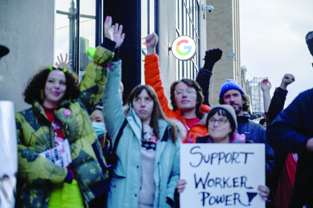 Members of the Alphabet Workers Union hold a rally outside the Google office in response to recent layoffs. -- AFP