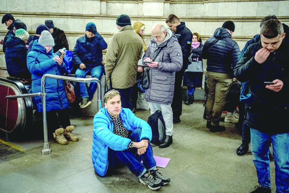 Residents take shelter in a metro station during an air strike alarm in Kyiv. -- AFP
