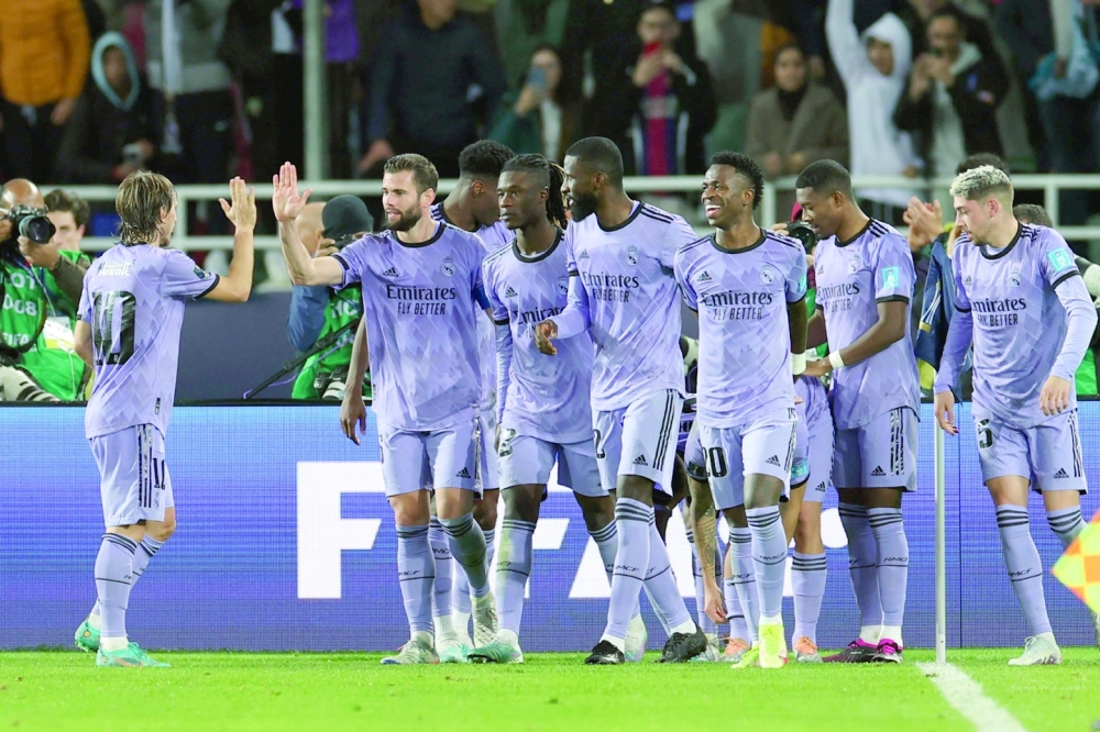 Real Madrid's players celebrate their third goal during the Fifa Club World Cup semifinal football match between Egypt's Al Ahly and Spain's Real Madrid at the Prince Moulay Abdellah Stadium in Rabat on February 8, 2023.  (Photo by FADEL SENNA / AFP)