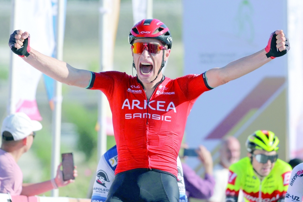 Team Arkea-Samsic Belgian rider Jenthe Biermans (L) celebrates after winning the sprint race of the Muscat Classic on February 10, 2023.  (Photo by Thomas SAMSON / AFP)