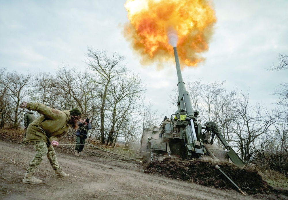 Soldiers fire a 2S7 Pion self-propelled gun on a frontline. Ukrainian soldiers are fighting to hold off a Russian push on the small eastern city of Bakhmut. -- Reuters 