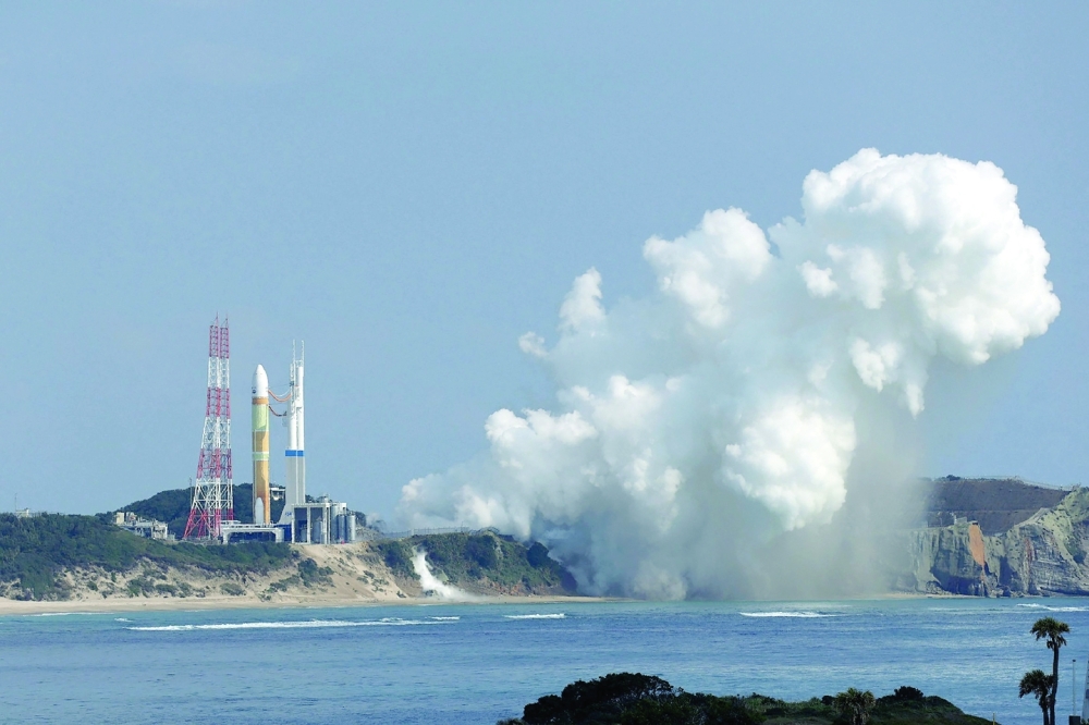 Smoke emerges from the main engines of the H3 rocket as it fails to lift off. -- AFP