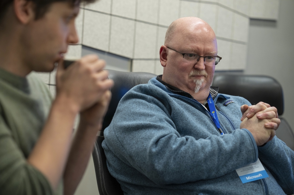 OpenAI CEO Sam Altman, left, and Microsoft Chief Technology Officer Kevin Scott at a media event introducing their Bing search engine using AI, at the Microsoft campus in Redmond, Wash. on February 7, 2023. (Ruth Fremson/The New York Times)